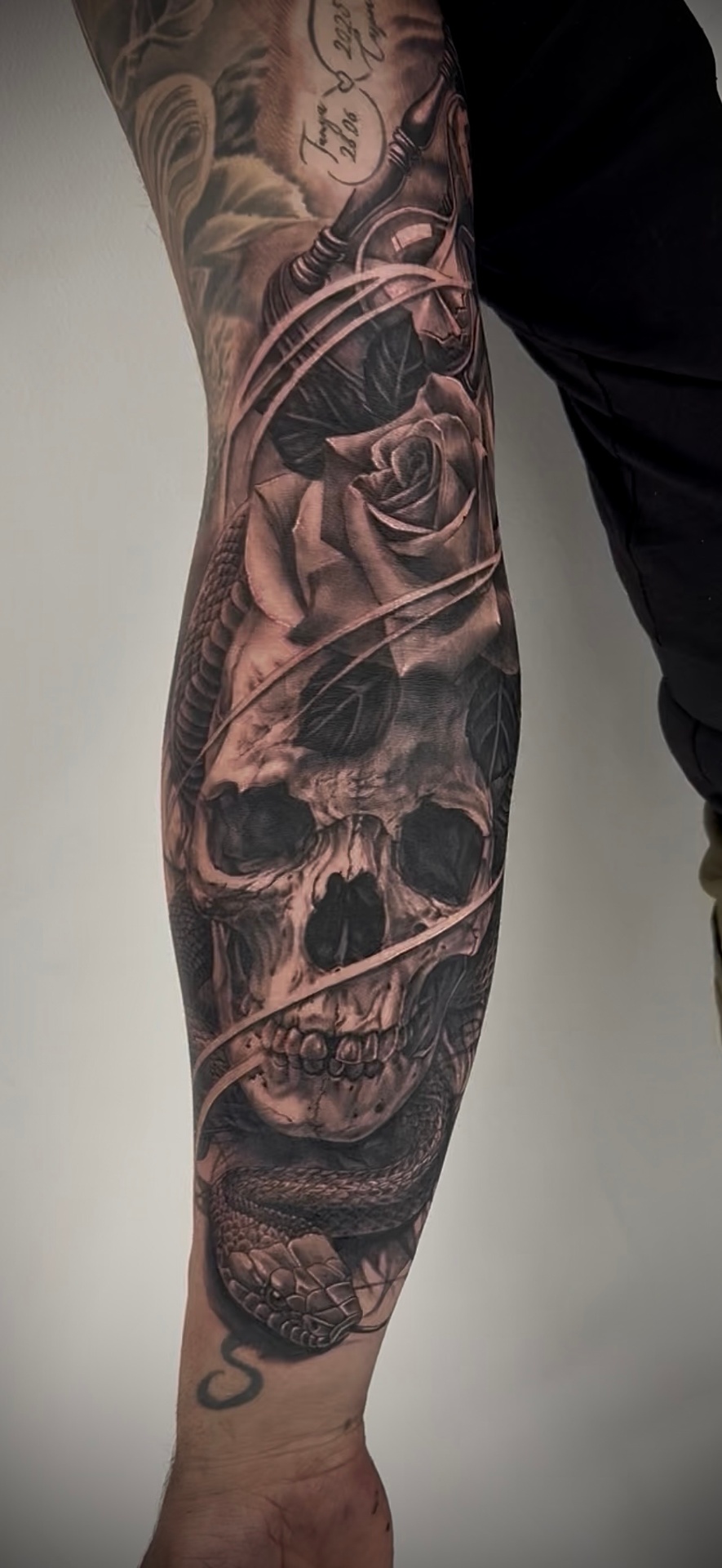 Skull, rose and snake leg piece