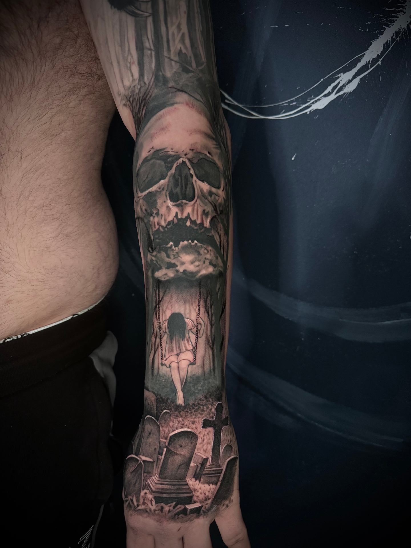 Skull, swing scene and graveyard arm sleeve