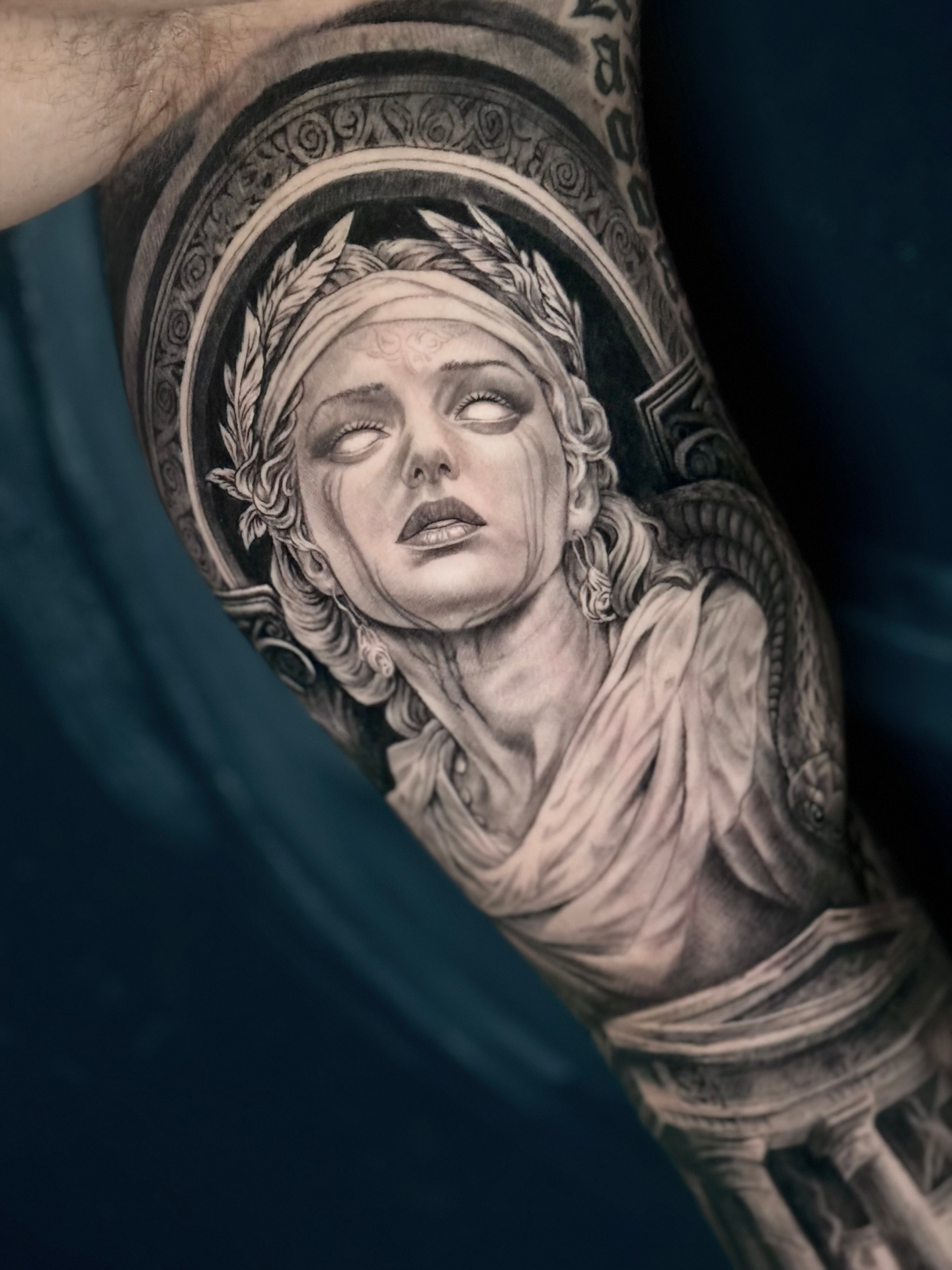 Greek goddess statue arm detail